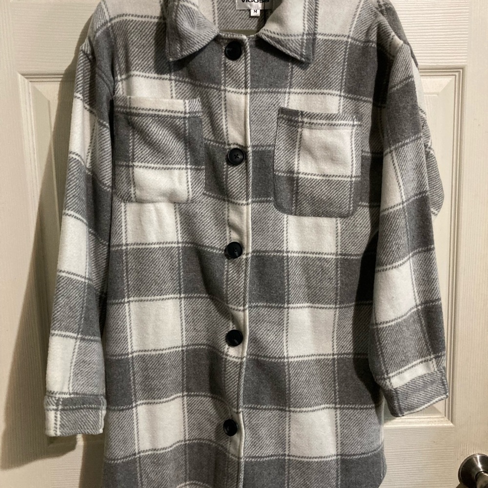 White and gray plaid sweater jacket.